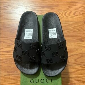 Gucci Black Slides with cut out logo. Size 38.